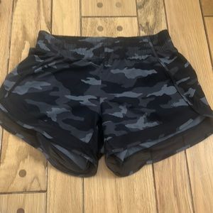 Camo print, never worn, zipper pocket